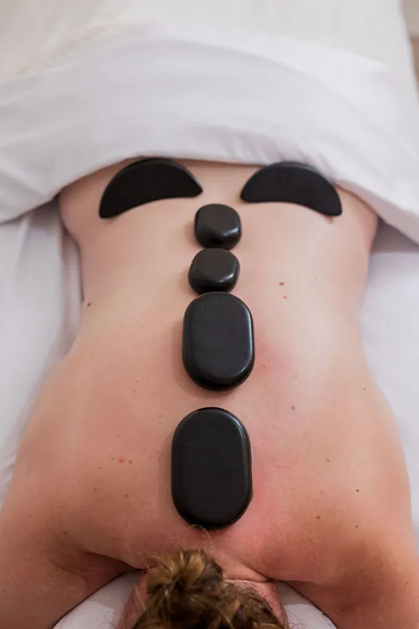 Body-Therapy-Hot-Stones on customers back